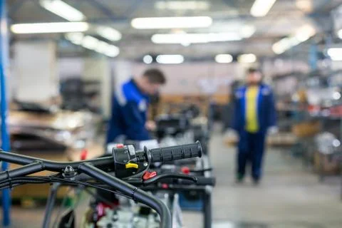 Assembly of motorcycle vehicles in the workshop Stock Photos