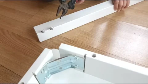Assembly of a table leg using metal fasteners, connector pins 스톡 동영상 339180131