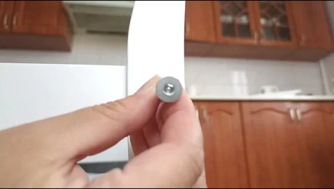 Assembly of white furniture using a hex wrench and metal bolt. Stock Footage 339176030