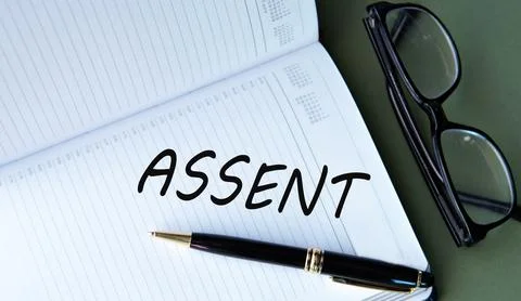 ASSENT - word in notebook on green background with glasses and pen Stock Photos
