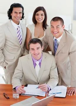 Assertive business people studying a document Stock Photos