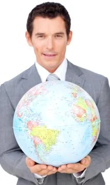 Assertive businessman holding a terrestrial globe Stock Photos