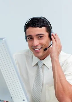 Assertive businessman using headset Stock Photos