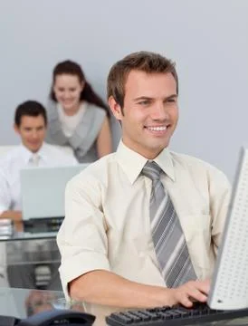 Assertive businessman working at his computer Stock Photos