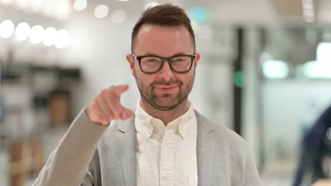Assertive Casual Young Man with Pointing at the Camera Stock Footage 138025670