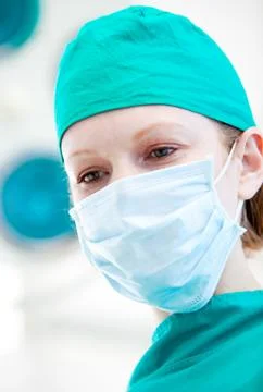 Assertive female surgeon before an intervention Stock Photos