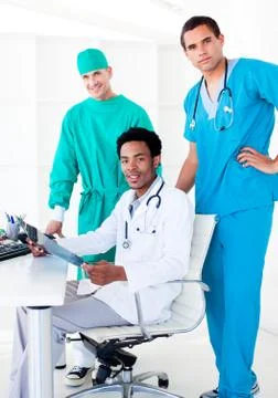 Assertive male doctors looking at X-Ray Stock Photos