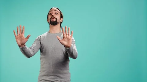 Assertive man doing stop hand gesture sign 스톡 동영상 319471520