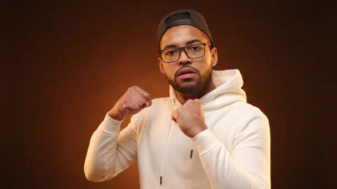 Assertive Man Making Threatening Gestures with Clenched Fists Stock Footage 269821541