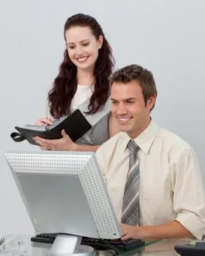 Assertive manager checking her employee's work Stock Photos