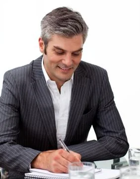 Assertive mature businessman studying a document Stock Photos