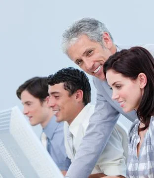 Assertive mature manager checking his employee's work Stock Photos