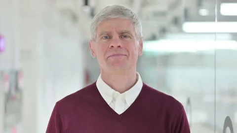 Assertive Middle Aged Man Pointing and Inviting Stock Footage 138026927