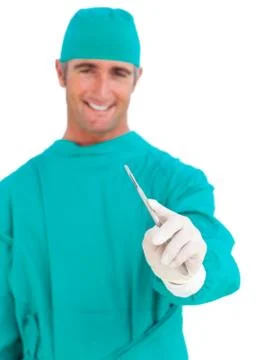 Assertive surgeon holding a stethoscope Stock Photos