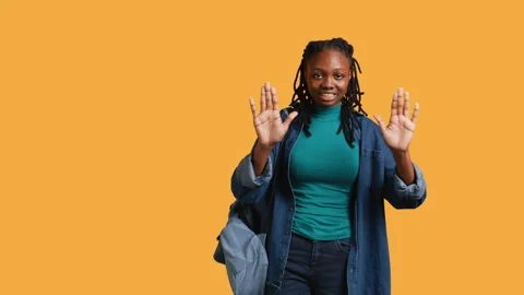 Assertive woman doing stop hand gesture, studio background Stock Footage 274172020