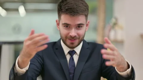 Assertive Young Businessman with Pointing and Inviting Stock Footage 137166780