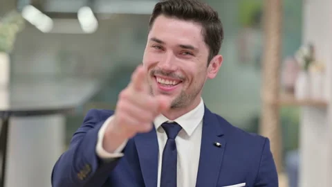 Assertive Young Businessman with Pointing at the Camera Stock Footage 135693084