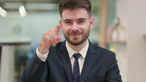 Assertive Young Businessman with Pointing at the Camera Stock Footage 137168416