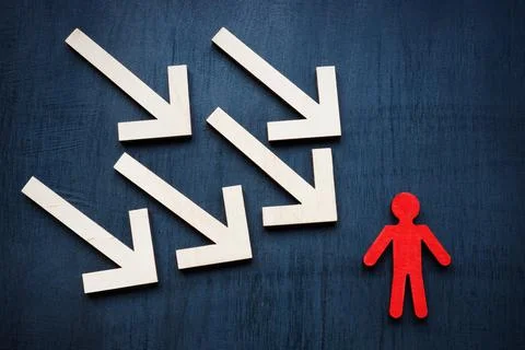 Assertiveness and resilience concept. Arrows and red figurine. Stock Photos