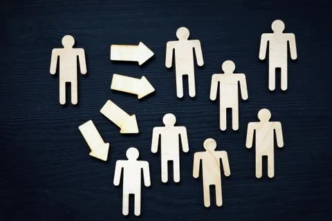 Assertiveness or leadership concept. Small figure, arrow and crowd. Stock Photos