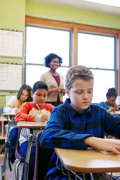 Assessment is a critical step in the learning process. a young boy sitting in Stock Photos