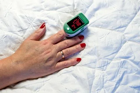 Assessment of the respiratory system function. Measurement of blood saturatio Stock Photos