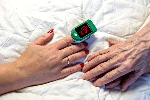 Assessment of the respiratory system function. Measurement of blood saturatio Stock Photos