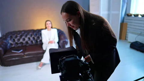 Assistant Adjusting Teleprompter Camera During Studio Interview. Assistant Stock Footage 334812854