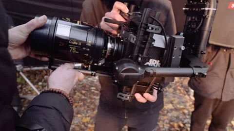 Assistant changes the lens on Arri Alexa's film camera. Stock Footage 167905406