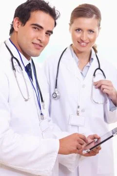 Assistant doctors with tablet Stock Photos