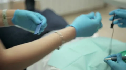 Assistant gives the surgeon a tool Stock Footage 63315014