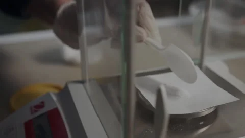 Assistant in gloves opens transparent window to weigh matter Stock Footage 254404893