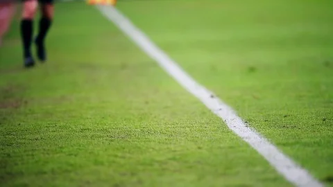 Assistant referee moving along the sideline during a soccer match Stock Footage 73512259
