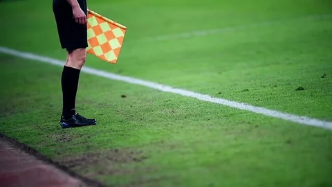 Assistant referee moving along the sideline during a soccer match 스톡 동영상 73512355