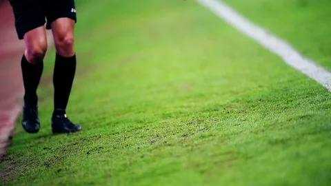 Assistant referee moving along the sideline during a soccer match 스톡 동영상 73512369