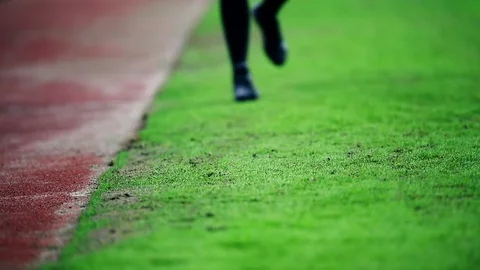 Assistant referee moving along the sideline during a soccer match 動画素材 73512387