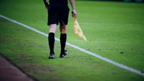 Assistant referee moving along the sideline during a soccer match 스톡 동영상 73908225
