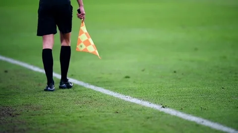Assistant referee moving along the sideline during a soccer match 스톡 동영상 73908248
