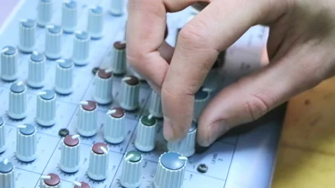 Assistant sound engineer at a responsible event. Microphone mixer with a lot of  Stock Footage 85687331