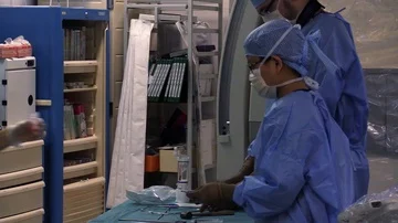 Assistant surgeon preparing equipment Stock Footage 85937127