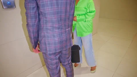 Assistant walk with device bag escorting woman Stock Footage 307901298