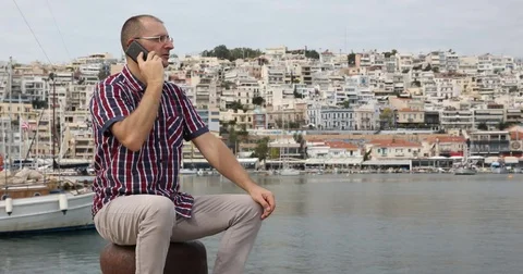 Associate Manager Man Talk Mobile Phone Contact in a Marina Port Water Transport Stock Footage 77064741