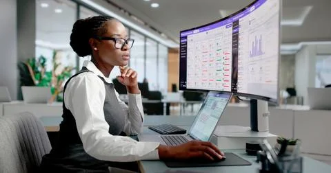Association Manager Updates Membership Database Using Laptop For Smooth Opera Stock Photos