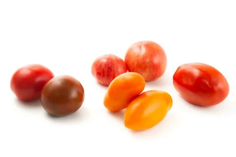 Assort of different shape and color tomatoes isolated on white background w.. Stock Photos