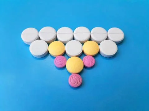 Assortative triangular pattern of med pills and capsules 스톡 사진