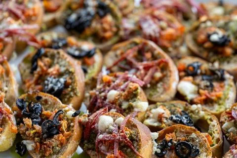 Assorted appetizer crostini with mixed toppings. Фото