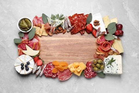 Assorted appetizer served on light grey table, top view. Space for text Stock Photos