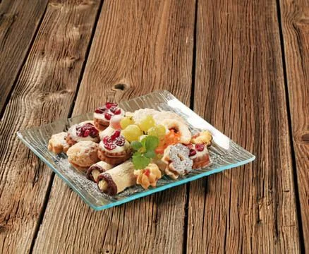 Assorted appetizers on a clear glass tray Stock Photos