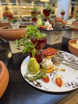 Assorted appetizers with decorative elements on plate at all-inclusive buffet 写真素材