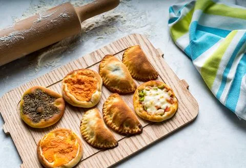 Assorted Arabic mini pastry served in board isolated on table top view of a.. Stock Photos